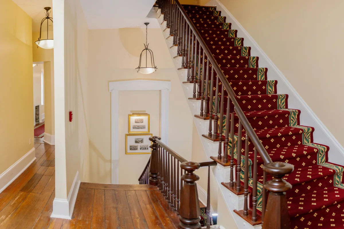 The carpeted staircase inside the Marshall House hotel, one of the most haunted places in Savannah