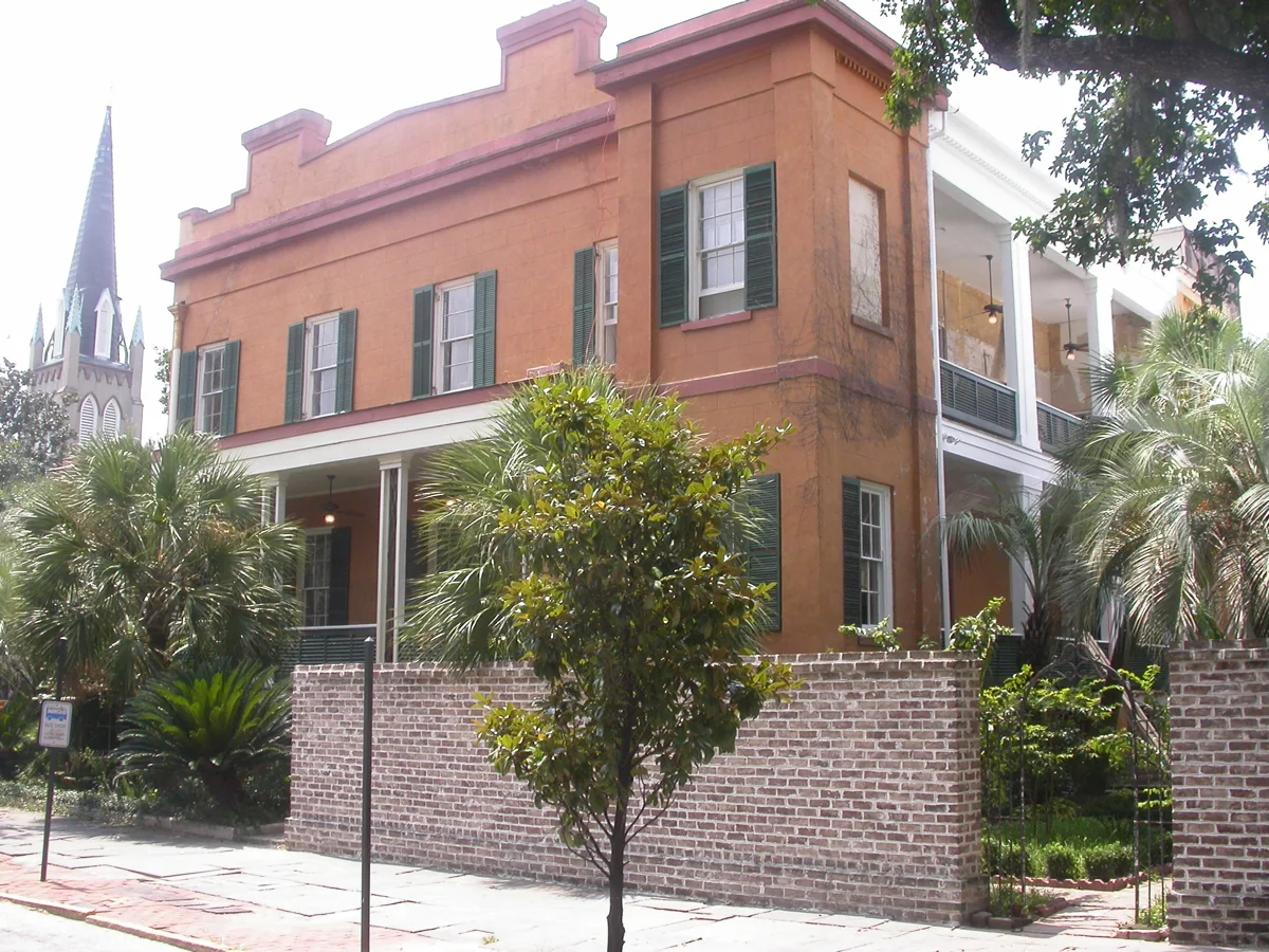 The Sorrel-Weed House and its brick courtyard wall on Madison Square, Savannah, a stop on ghost tours in Savannah GA